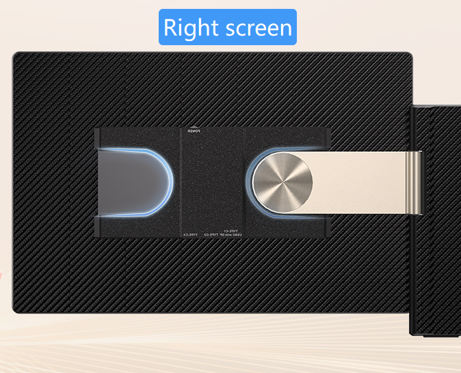 Black textured screen with a metallic object on a light wood surface
